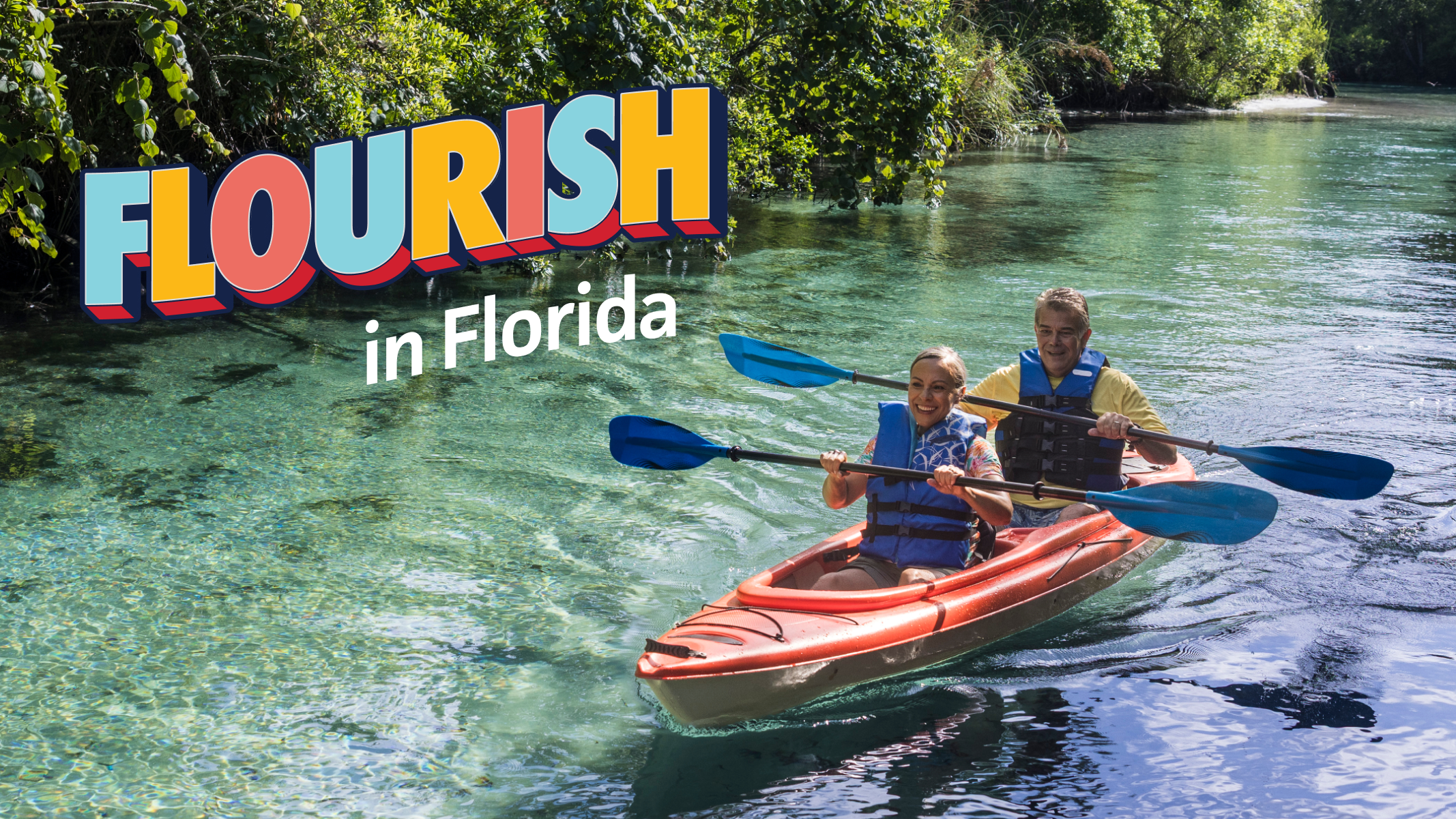 Senior woman and senior man kayaking on a clear Florida spring​​ 